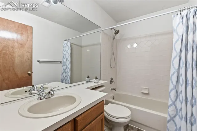 a bathroom with a sink toilet tub and shower