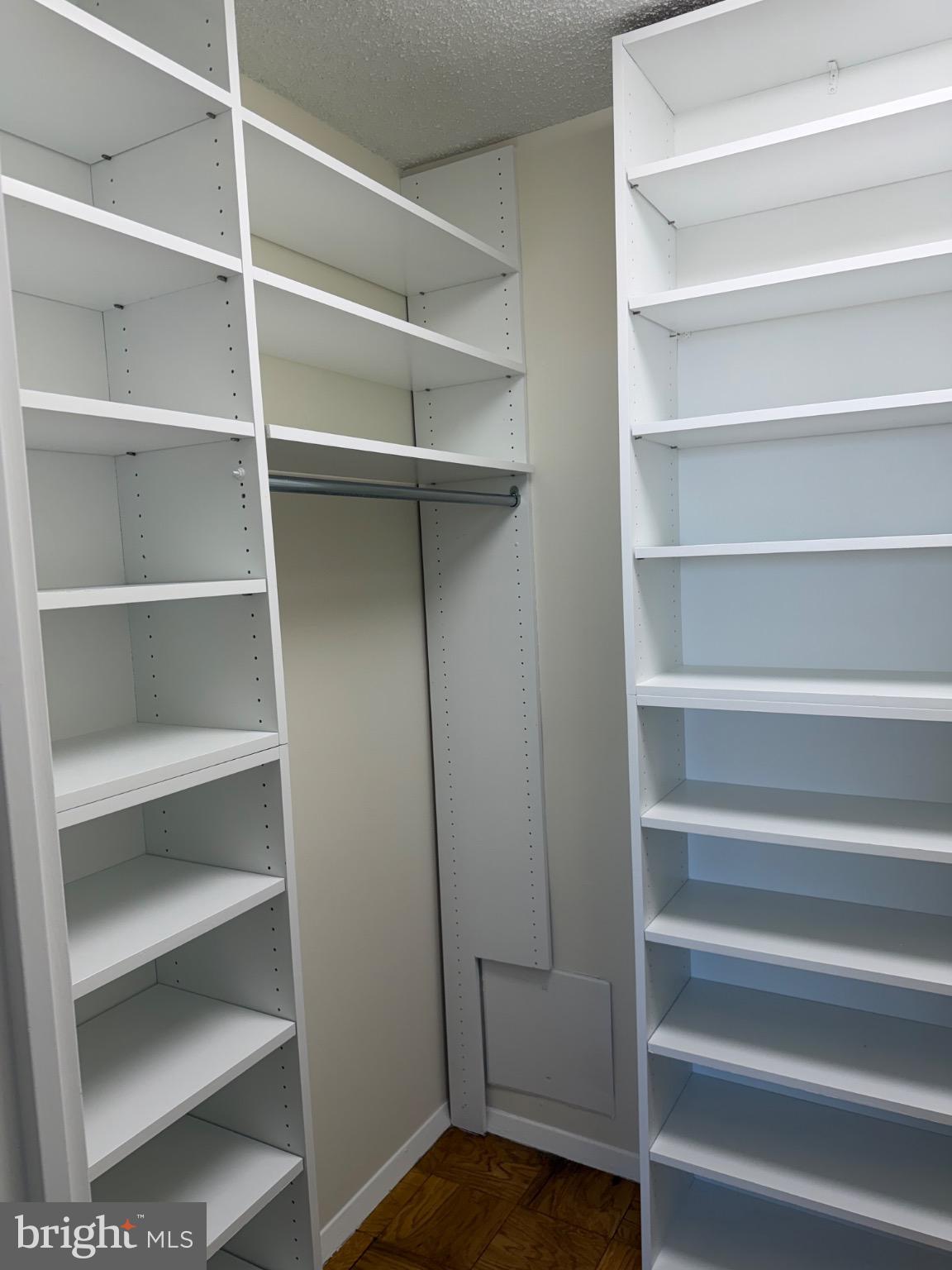 5225 Pooks Hill Road, Unit 1804N Bethesda, MD 20814 - Photo 16 of 44 a view of walk in closet with empty racks