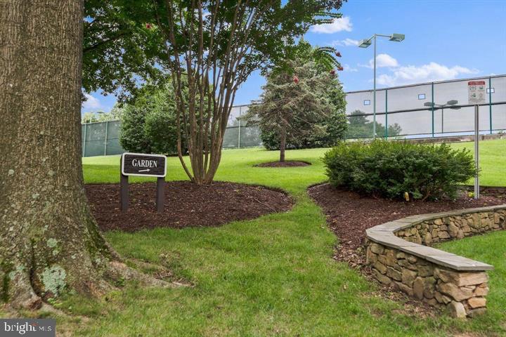 5225 Pooks Hill Road, Unit 1804N Bethesda, MD 20814 - Photo 33 of 44 a view of a garden with a bench