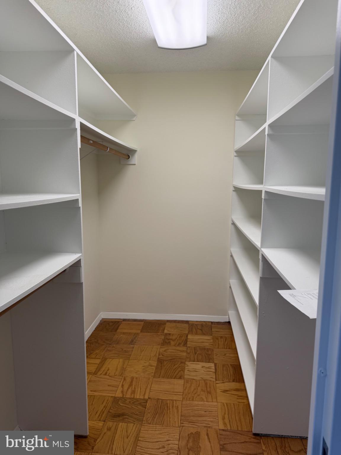 5225 Pooks Hill Road, Unit 1804N Bethesda, MD 20814 - Photo 4 of 44 a view of walk in closet with empty racks