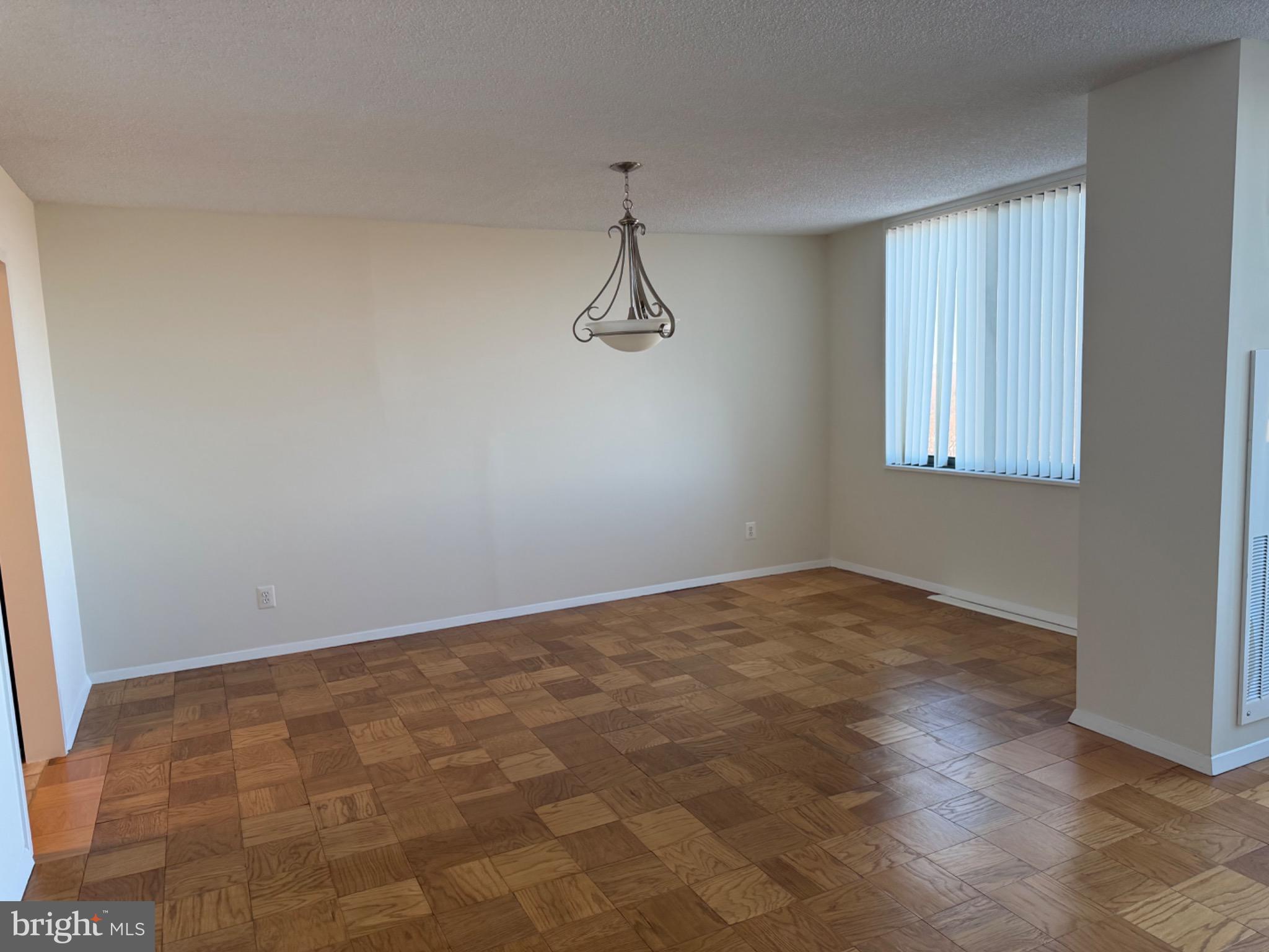 5225 Pooks Hill Road, Unit 1804N Bethesda, MD 20814 - Photo 5 of 44 a view of a room with wooden floor and windows