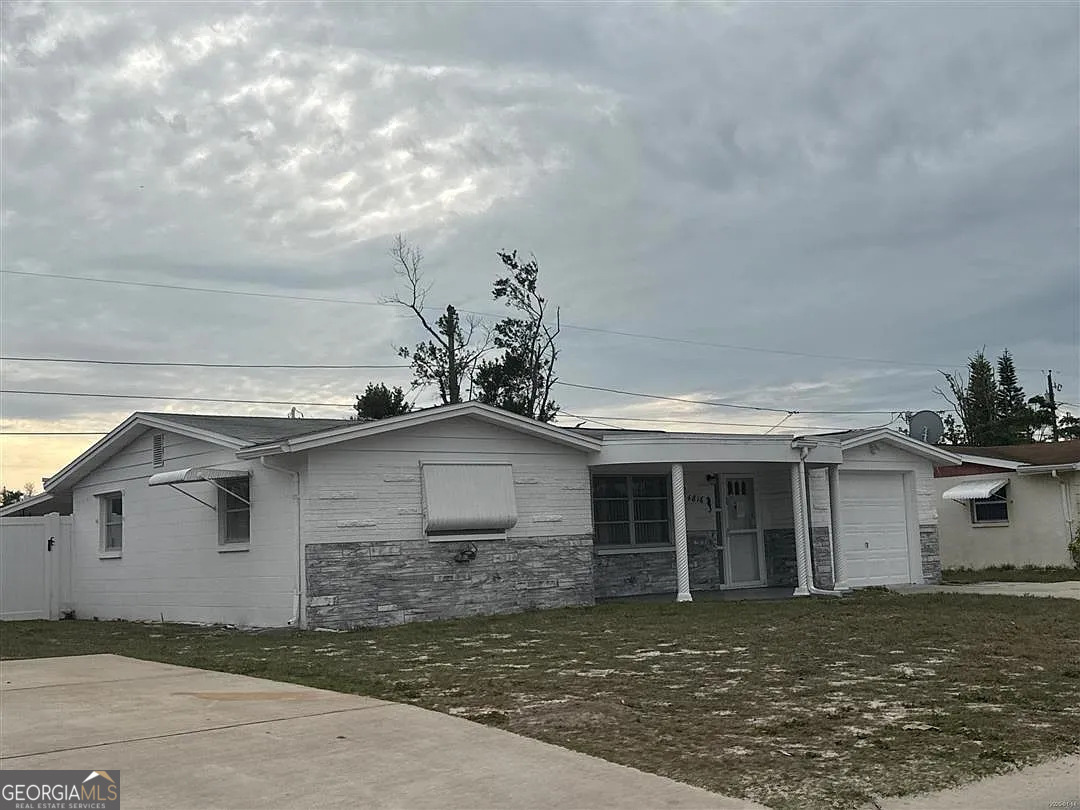 front view of a house with a yard