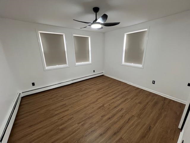 15 George Street, Unit 2 Bayonne, NJ 07002 - Photo 2 of 9 a view of an empty room with wooden floor and a window