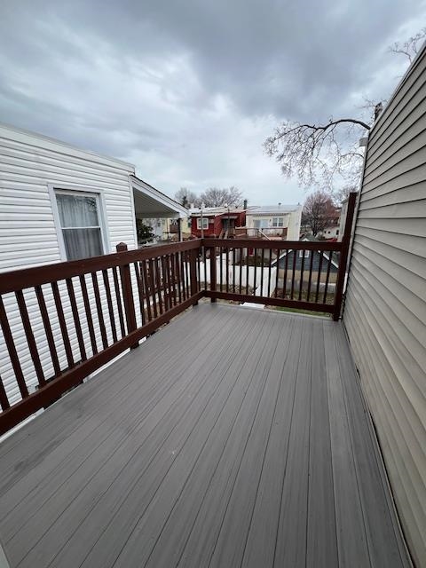 15 George Street, Unit 2 Bayonne, NJ 07002 - Photo 7 of 9 a view of a balcony with wooden floor