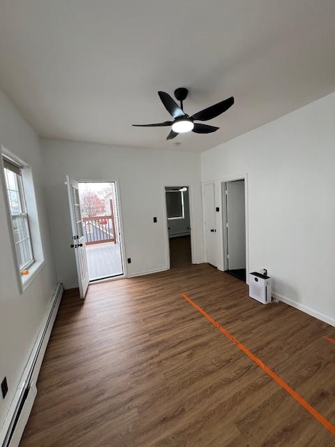 15 George Street, Unit 2 Bayonne, NJ 07002 - Photo 8 of 9 wooden floor in an empty room with a window