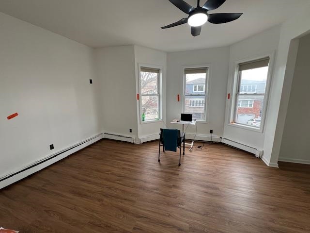 15 George Street, Unit 2 Bayonne, NJ 07002 - Photo 9 of 9 an empty room with wooden floor and windows