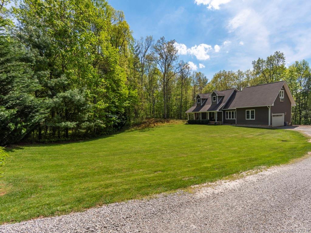 58 Thunder Ridge Road Canton, NC 28716 - Photo 1 of 26 a view of a house with a big yard