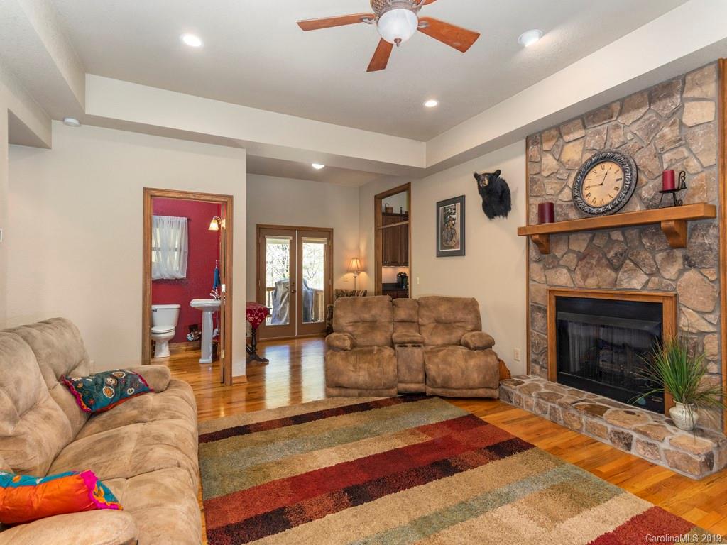 58 Thunder Ridge Road Canton, NC 28716 - Photo 17 of 26 a living room with furniture and a fireplace