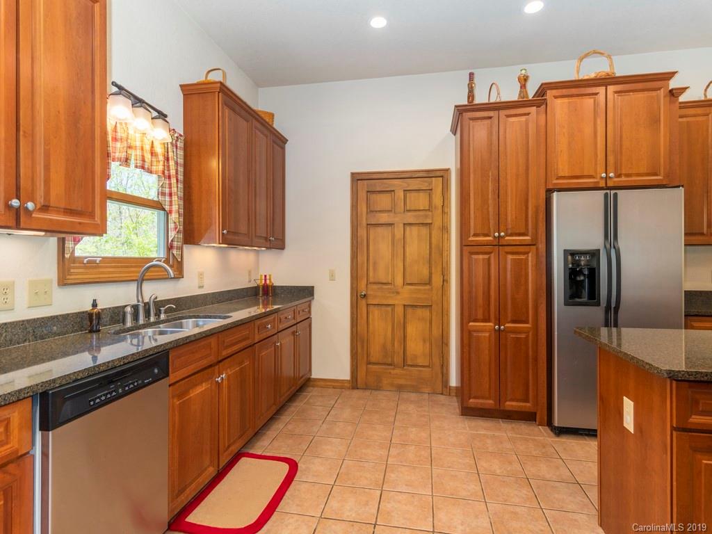58 Thunder Ridge Road Canton, NC 28716 - Photo 3 of 26 a kitchen with stainless steel appliances a refrigerator and a sink