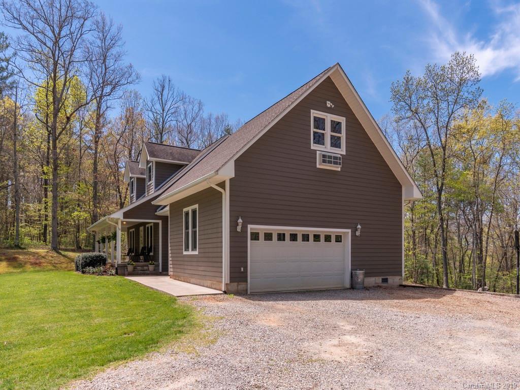 58 Thunder Ridge Road Canton, NC 28716 - Photo 25 of 26 a front view of a house with a yard and garage