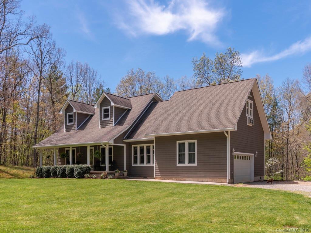 58 Thunder Ridge Road Canton, NC 28716 - Photo 26 of 26 a big house with tall trees in the background