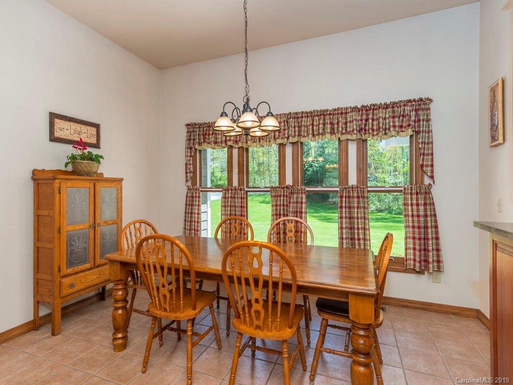 58 Thunder Ridge Road Canton, NC 28716 - Photo 6 of 26 a view of a dining room with furniture window and outside view