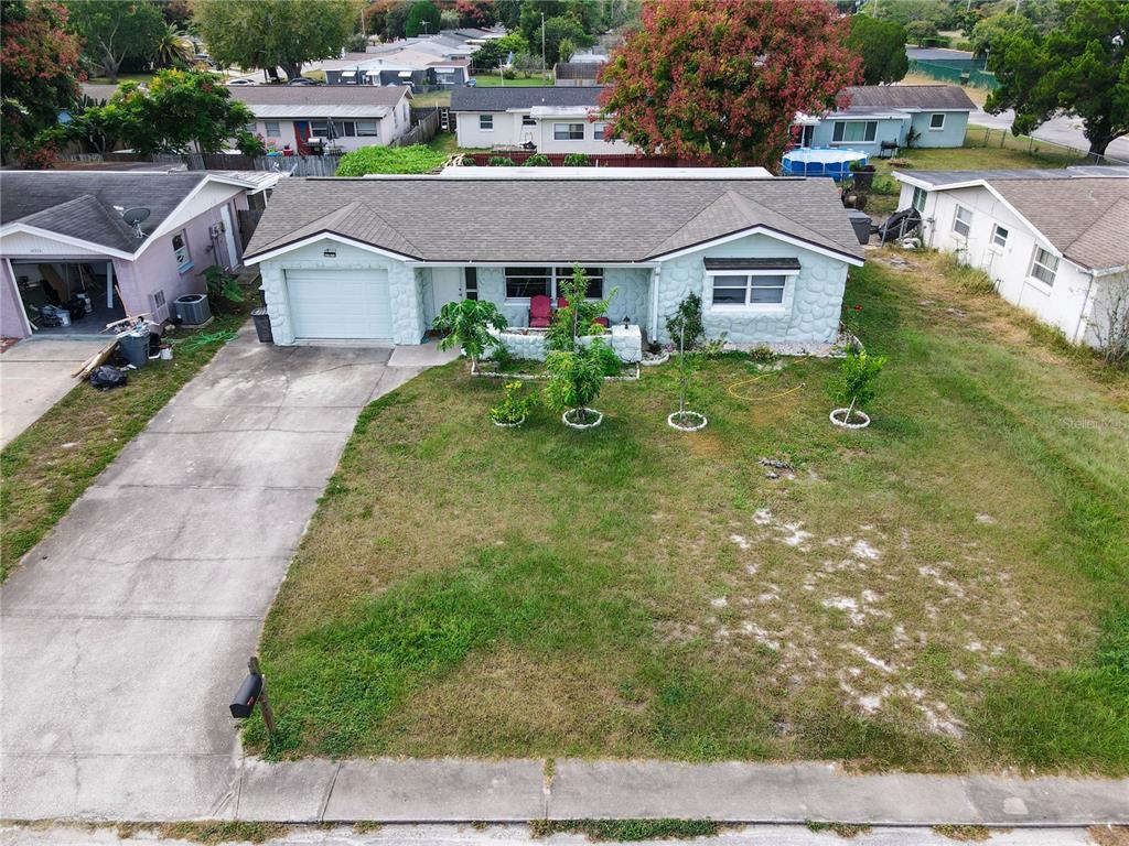 10921 Kingsbridge Road Port Richey, FL 34668 - Photo 1 of 1 a aerial view of a house with swimming pool