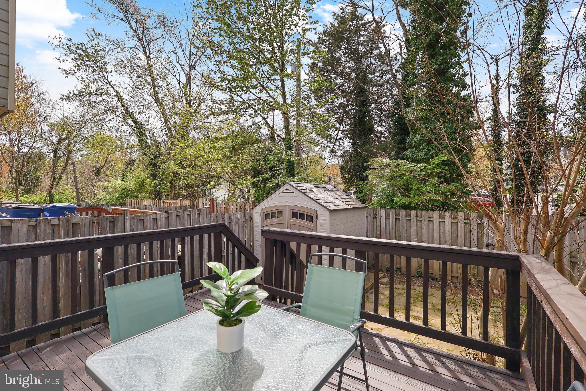 1108 Casper Drive Herndon, VA 20170 - Photo 12 of 24 a view of a deck with a chair and wooden floor