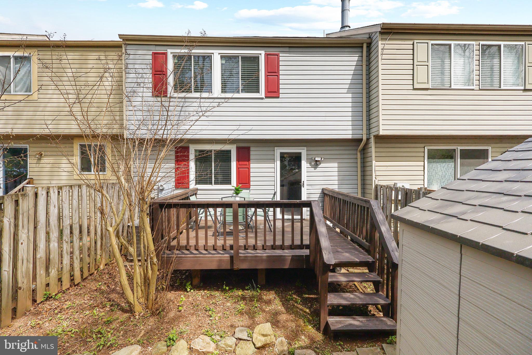 1108 Casper Drive Herndon, VA 20170 - Photo 13 of 24 a view of a house with a wooden deck