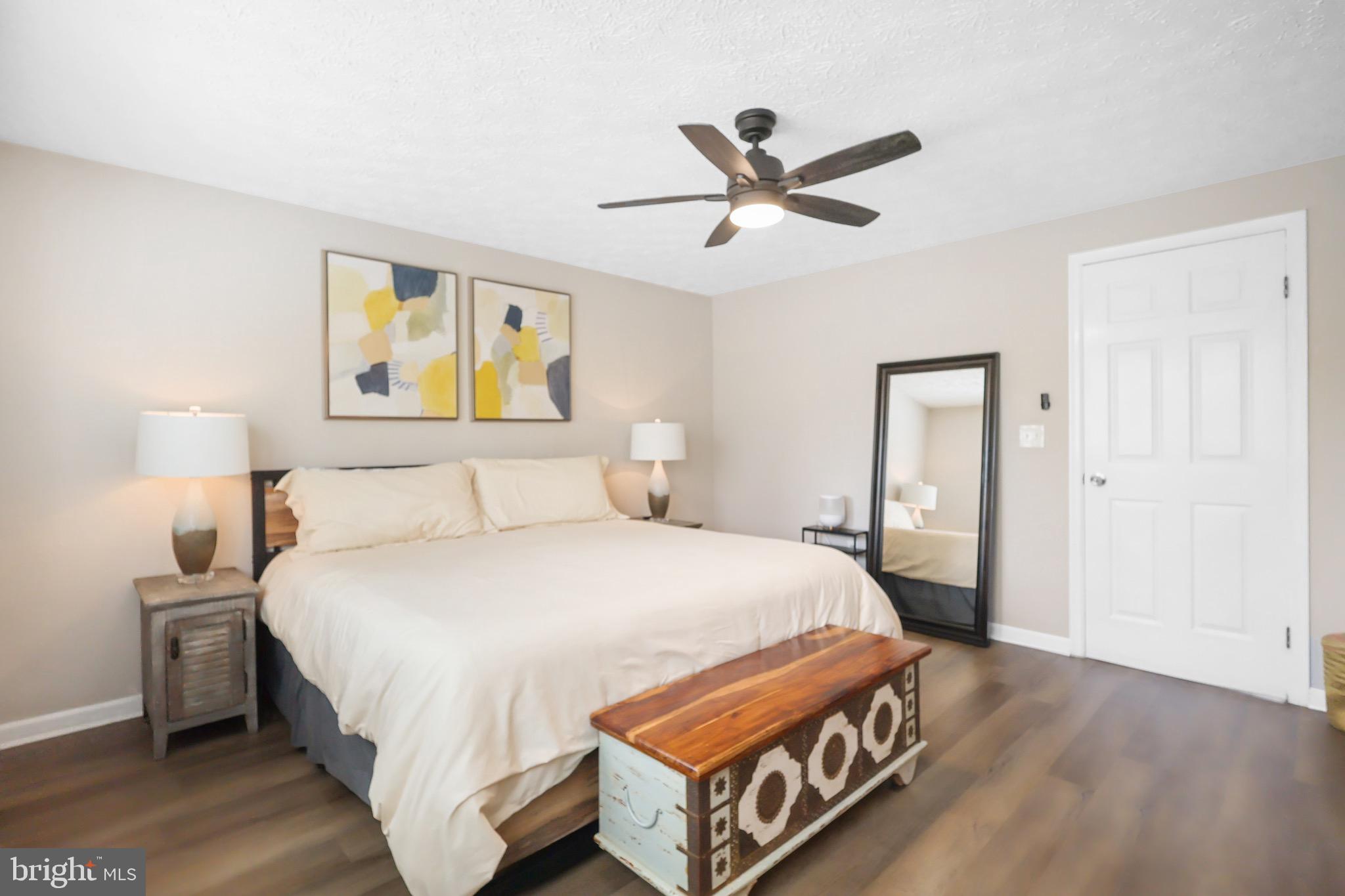 1108 Casper Drive Herndon, VA 20170 - Photo 16 of 24 a bedroom with a bed and painting on the wall