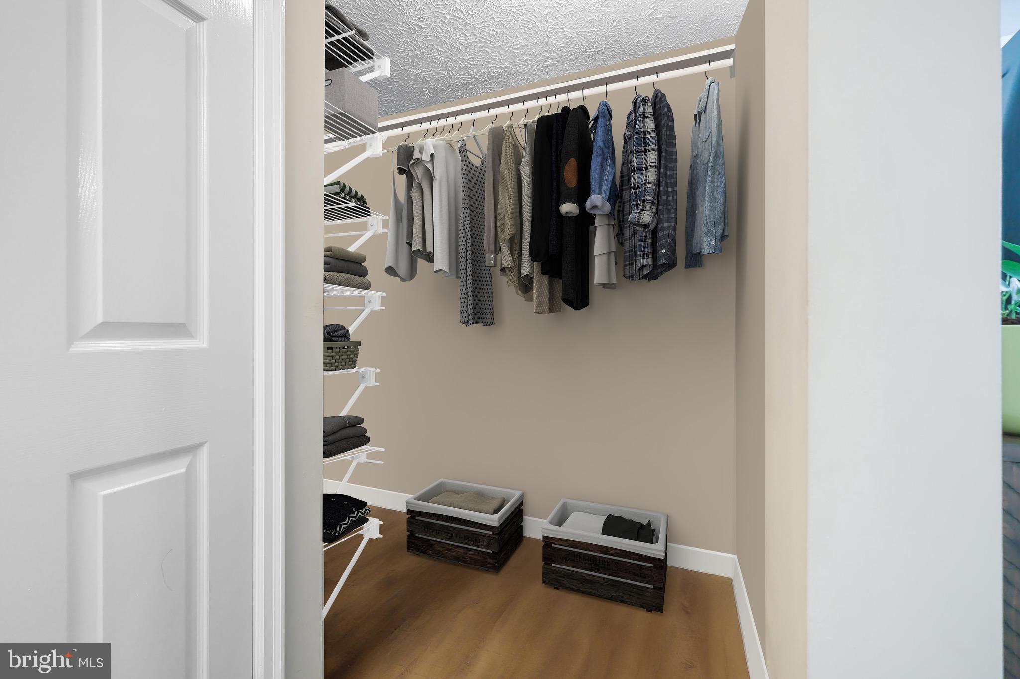 1108 Casper Drive Herndon, VA 20170 - Photo 18 of 24 a view of walk in closet with clothes and shoes