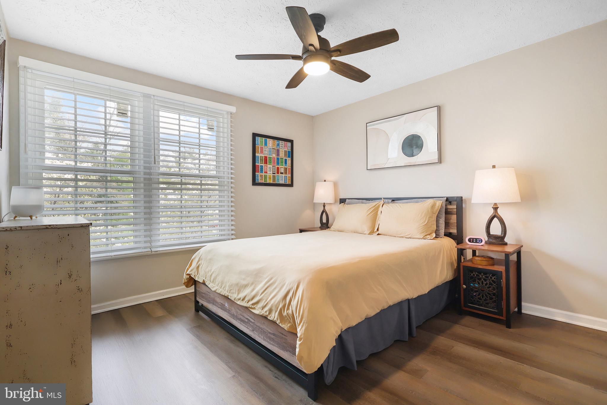 1108 Casper Drive Herndon, VA 20170 - Photo 19 of 24 a bedroom with a large bed and a window