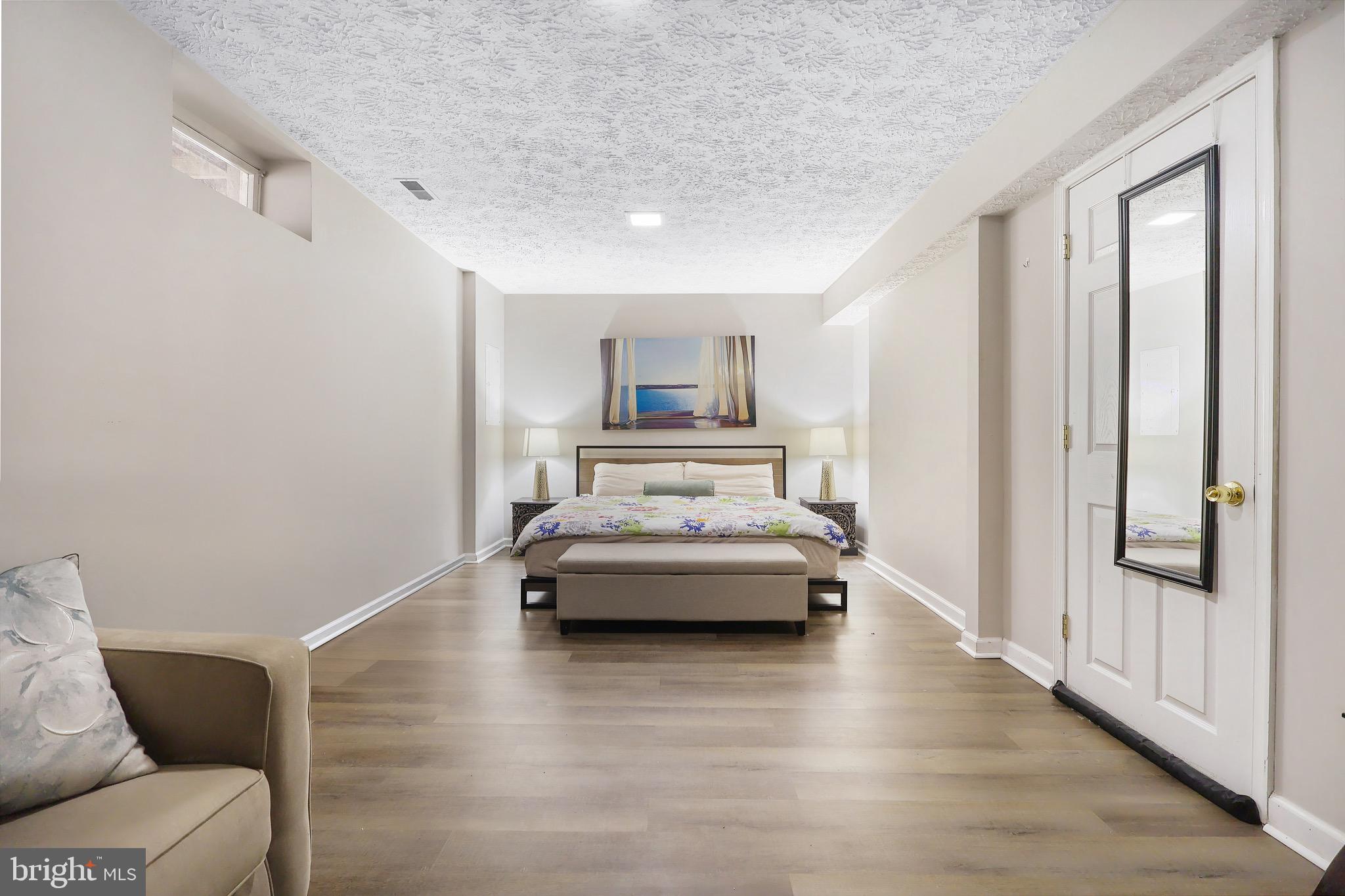 1108 Casper Drive Herndon, VA 20170 - Photo 22 of 24 a living room with furniture and a large window
