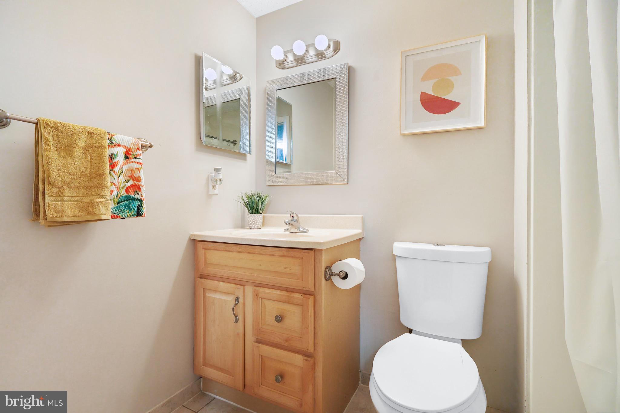 1108 Casper Drive Herndon, VA 20170 - Photo 23 of 24 a bathroom with a toilet sink and mirror