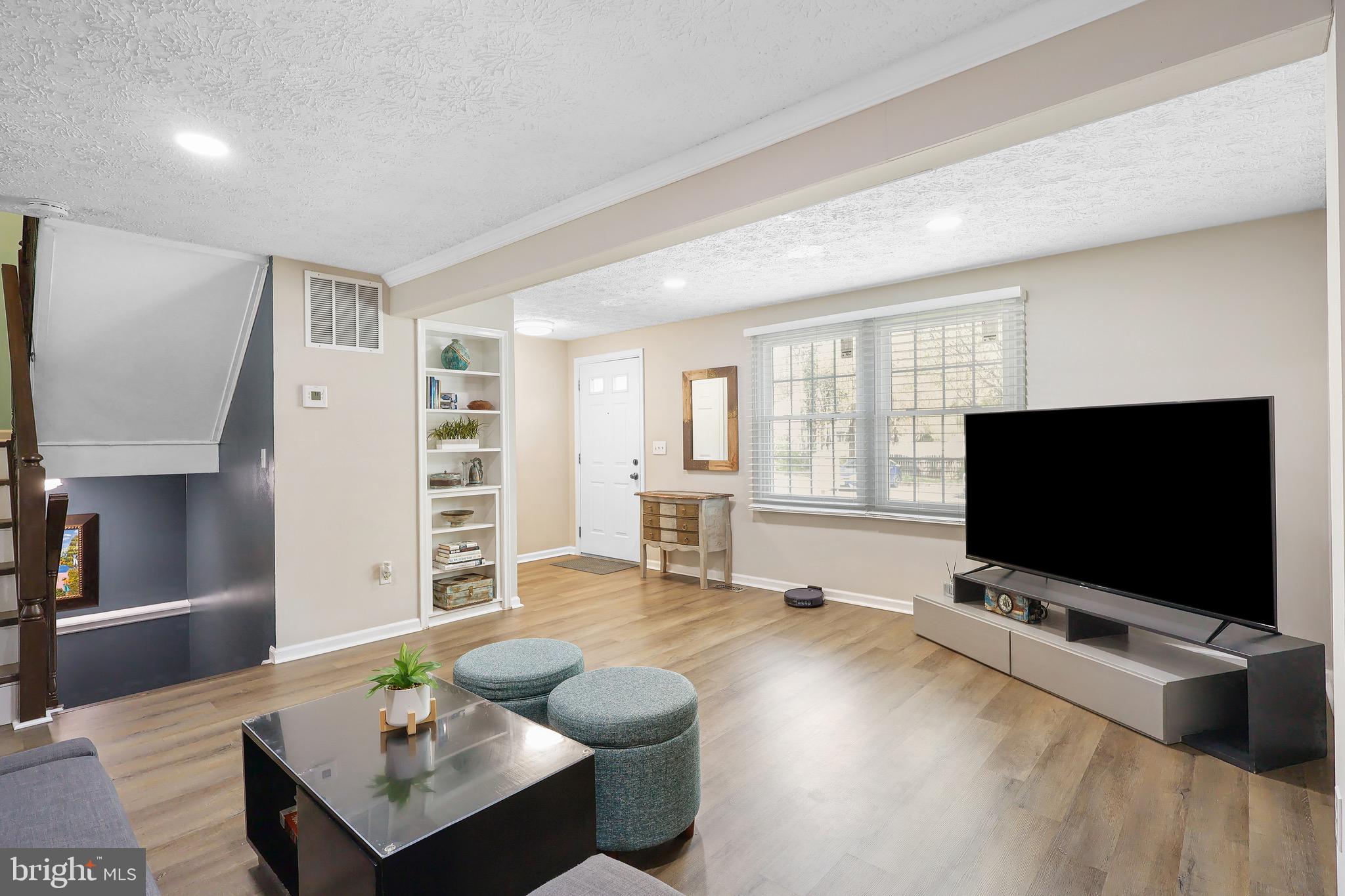 1108 Casper Drive Herndon, VA 20170 - Photo 4 of 24 a living room with furniture and a flat screen tv