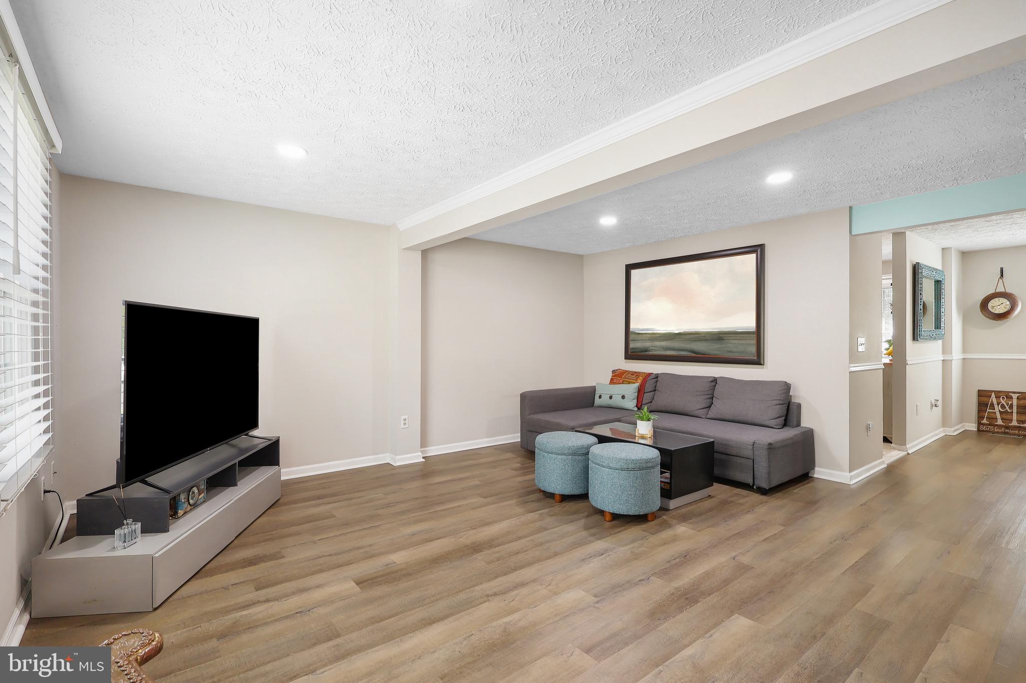 1108 Casper Drive Herndon, VA 20170 - Photo 5 of 24 a living room with furniture and a flat screen tv