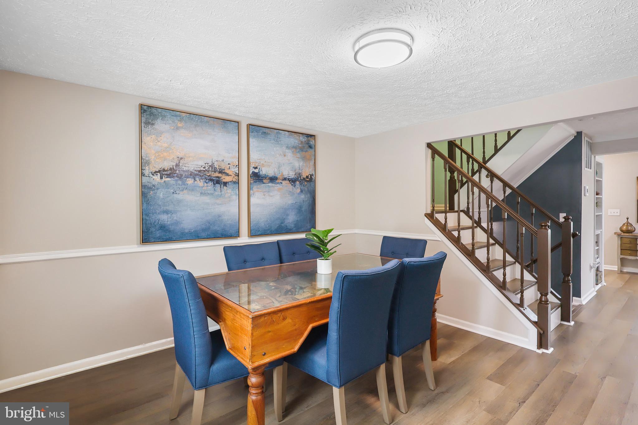 1108 Casper Drive Herndon, VA 20170 - Photo 7 of 24 a dining room with furniture and wooden floor