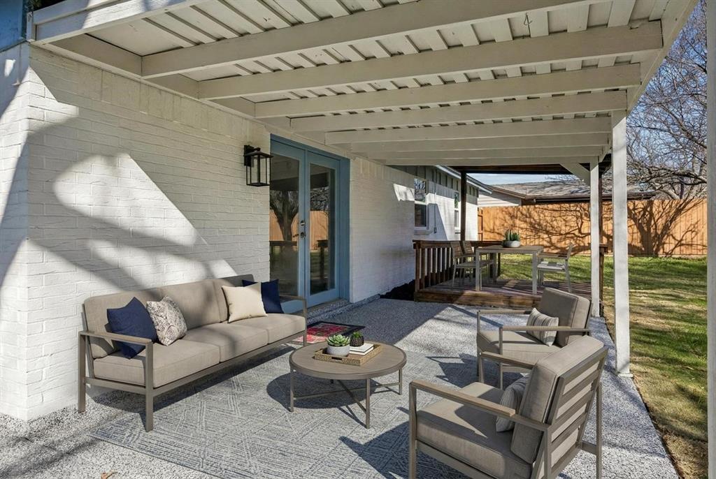 312 East Hampton Road Crowley, TX 76036 - Photo 14 of 19 Patio has fresh epoxy flooring adding tot the clean beautiful look of this home. Wait til you see the backyard!