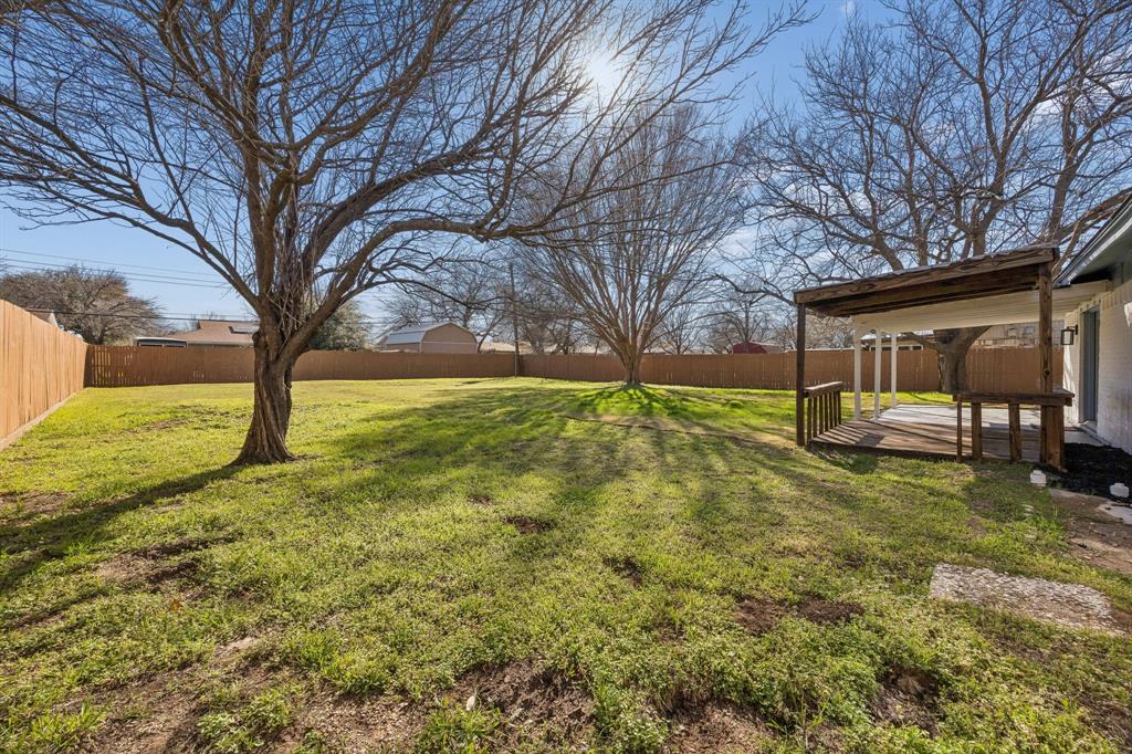 312 East Hampton Road Crowley, TX 76036 - Photo 17 of 19 Enormous backyard for fun, kids or pets!