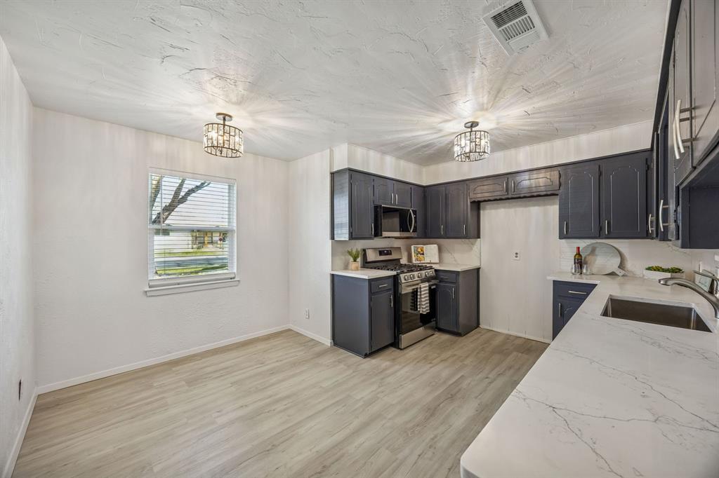 312 East Hampton Road Crowley, TX 76036 - Photo 2 of 19 Brand new Luxury vinyl plank and lighting as well.