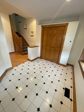 a bedroom with a bed and cabinets