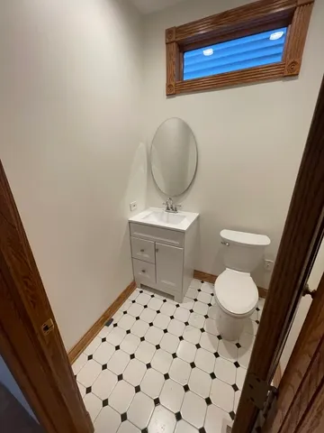 a bathroom with a toilet and a sink