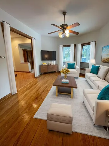 a living room with furniture and a flat screen tv