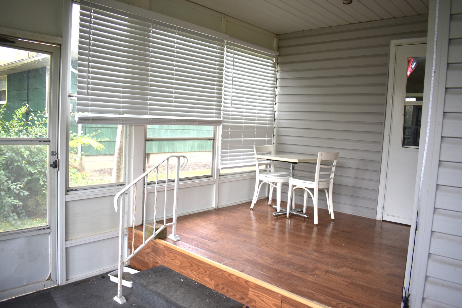 1500 Manhattan Drive Streator, IL 61364 - Photo 13 of 24 a view of a dining room with furniture and wooden floor