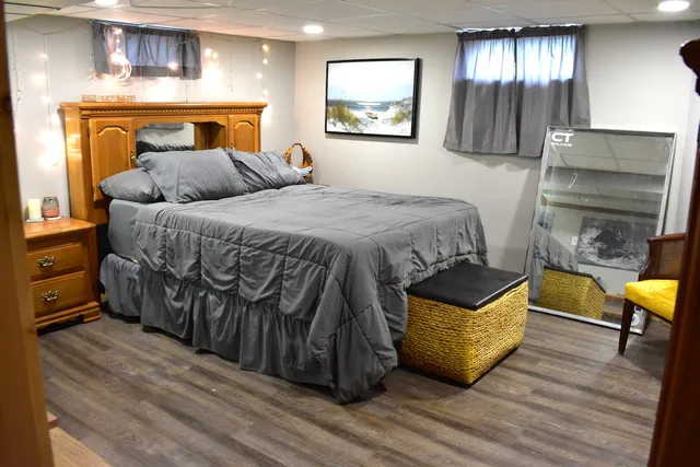 a bedroom with a bed and a dresser