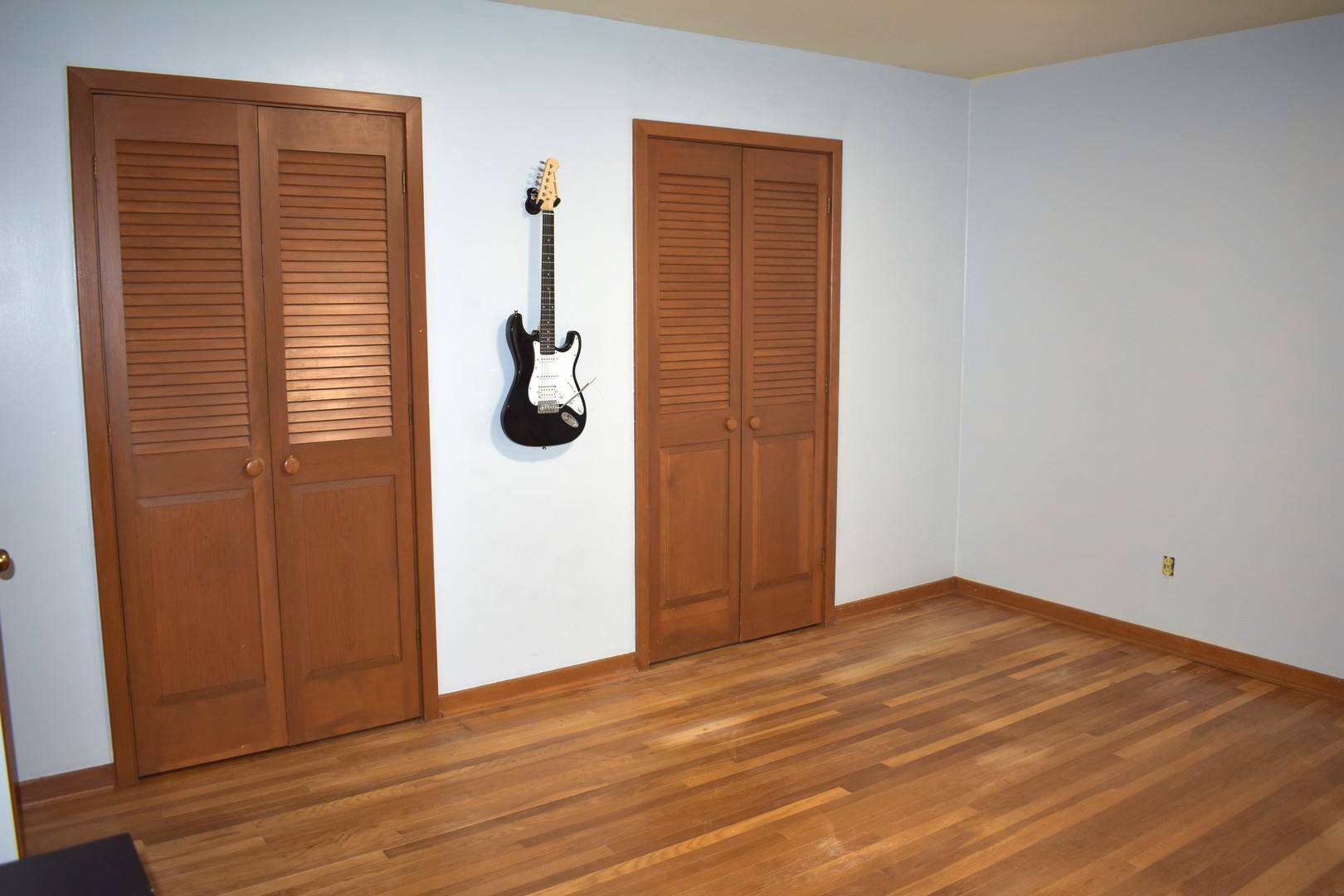 1500 Manhattan Drive Streator, IL 61364 - Photo 8 of 24 an empty room with wooden floor and windows