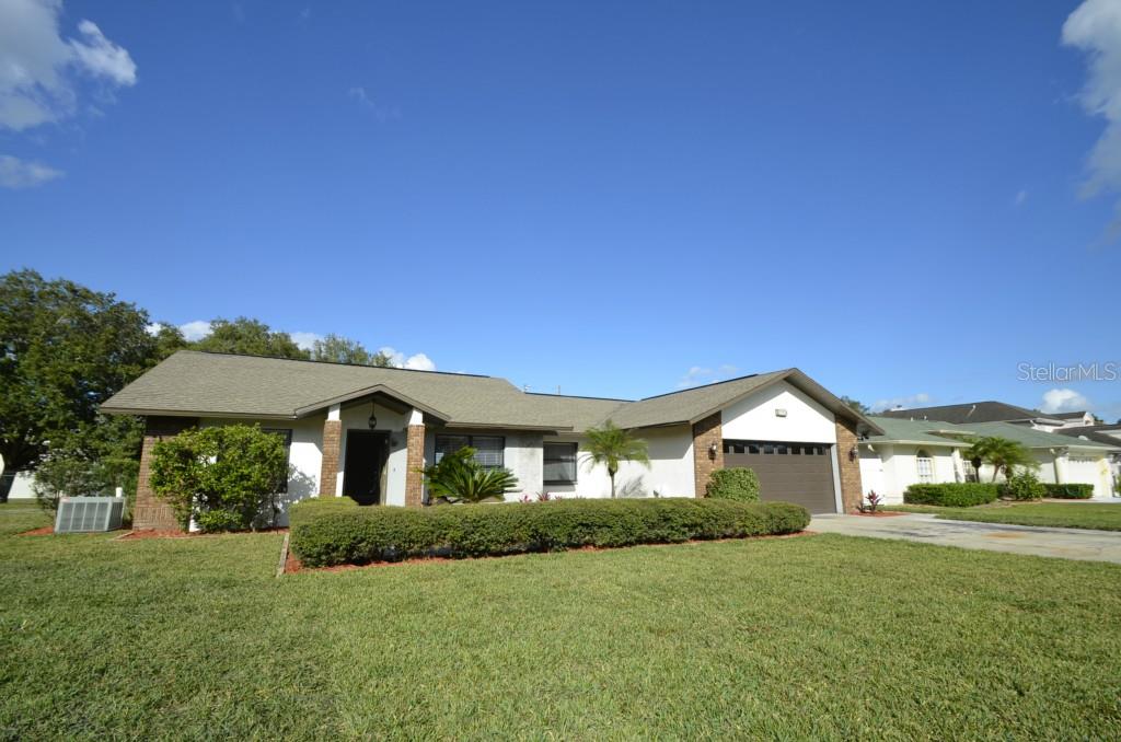 7428 Herricks Loop Orlando, FL 32835 - Photo 1 of 1 a front view of a house with a yard