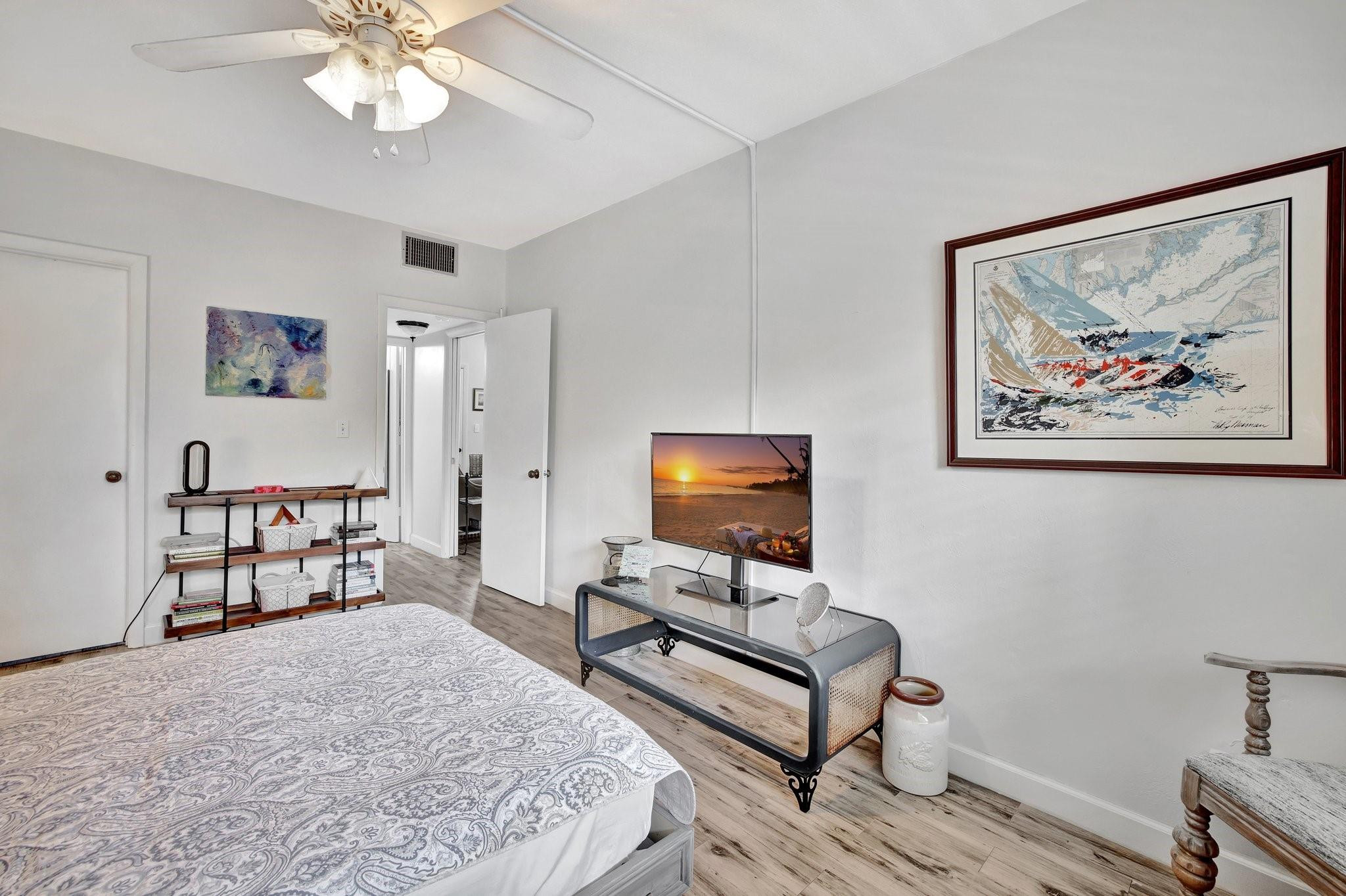 1450 North Riverside Drive, Unit 102 Pompano Beach, FL 33062 - Photo 13 of 32 a bedroom with furniture and a bed