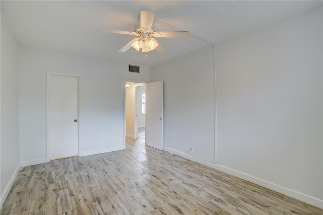 1450 North Riverside Drive, Unit 102 Pompano Beach, FL 33062 - Photo 14 of 32 wooden floor in an empty room