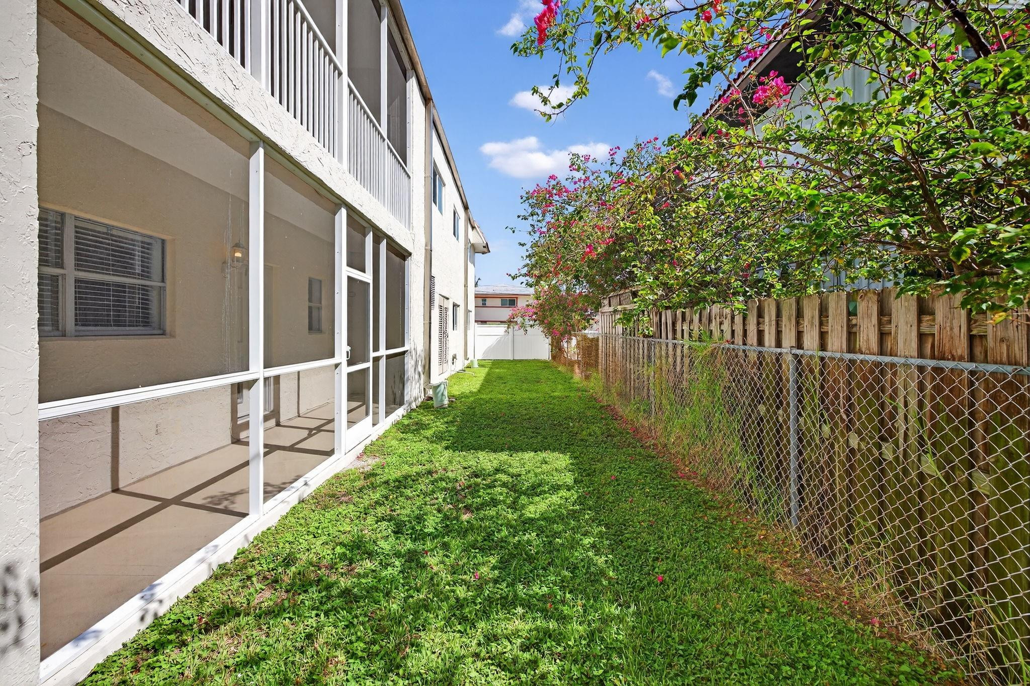 1450 North Riverside Drive, Unit 102 Pompano Beach, FL 33062 - Photo 17 of 32 a view of backyard with garden