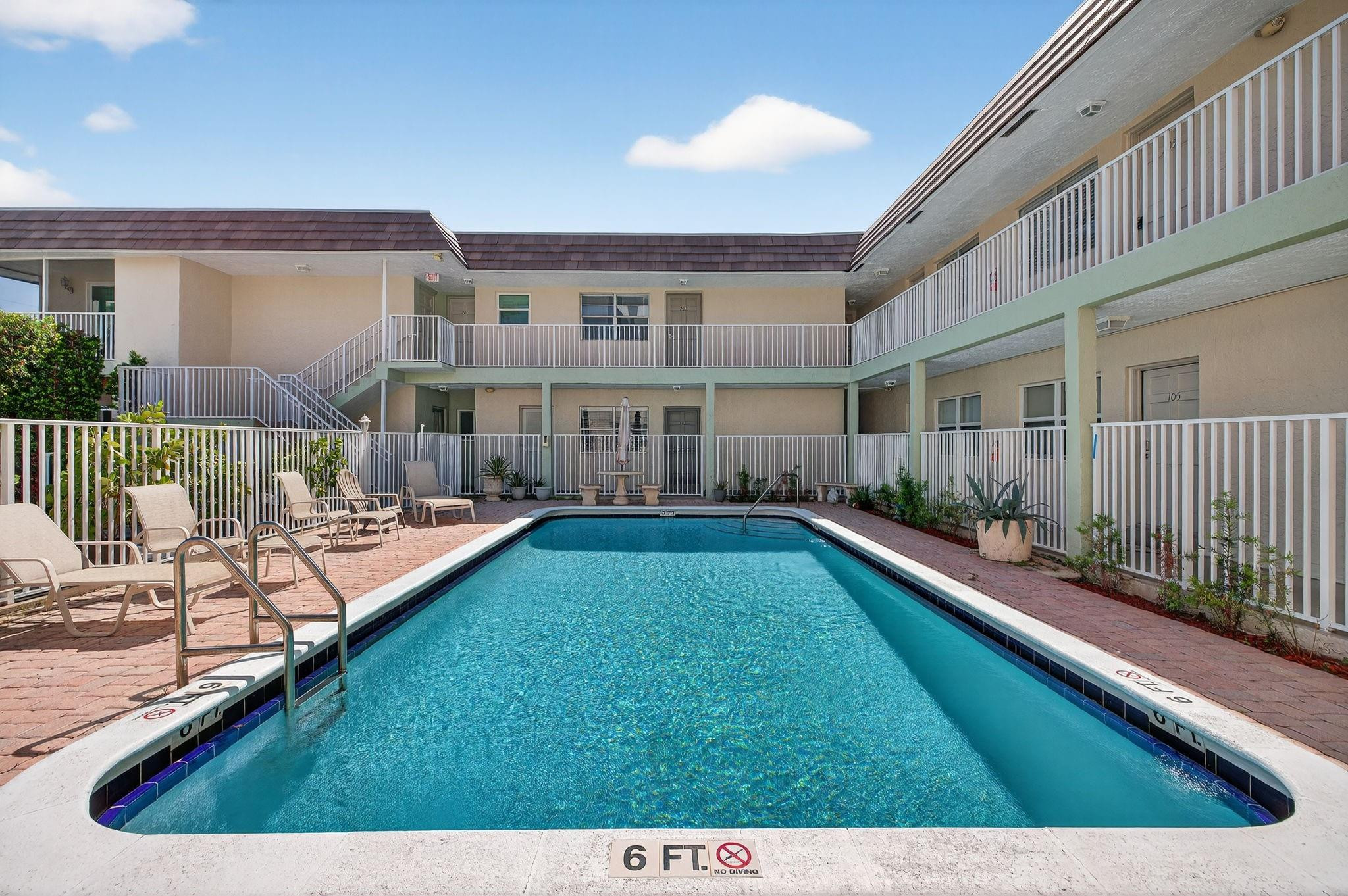1450 North Riverside Drive, Unit 102 Pompano Beach, FL 33062 - Photo 21 of 32 a view of a house with a swimming pool