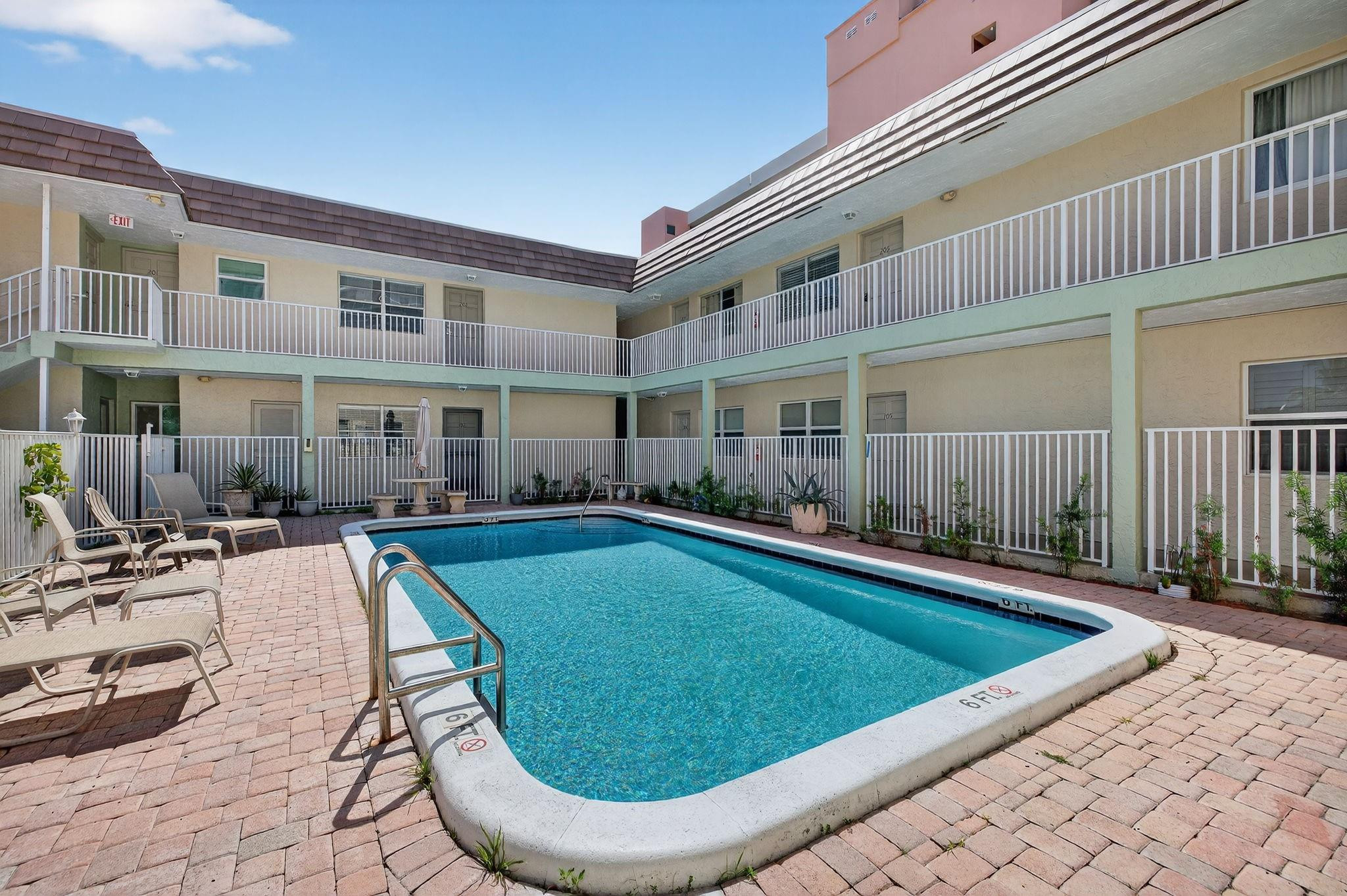 1450 North Riverside Drive, Unit 102 Pompano Beach, FL 33062 - Photo 22 of 32 a view of swimming pool with outdoor seating