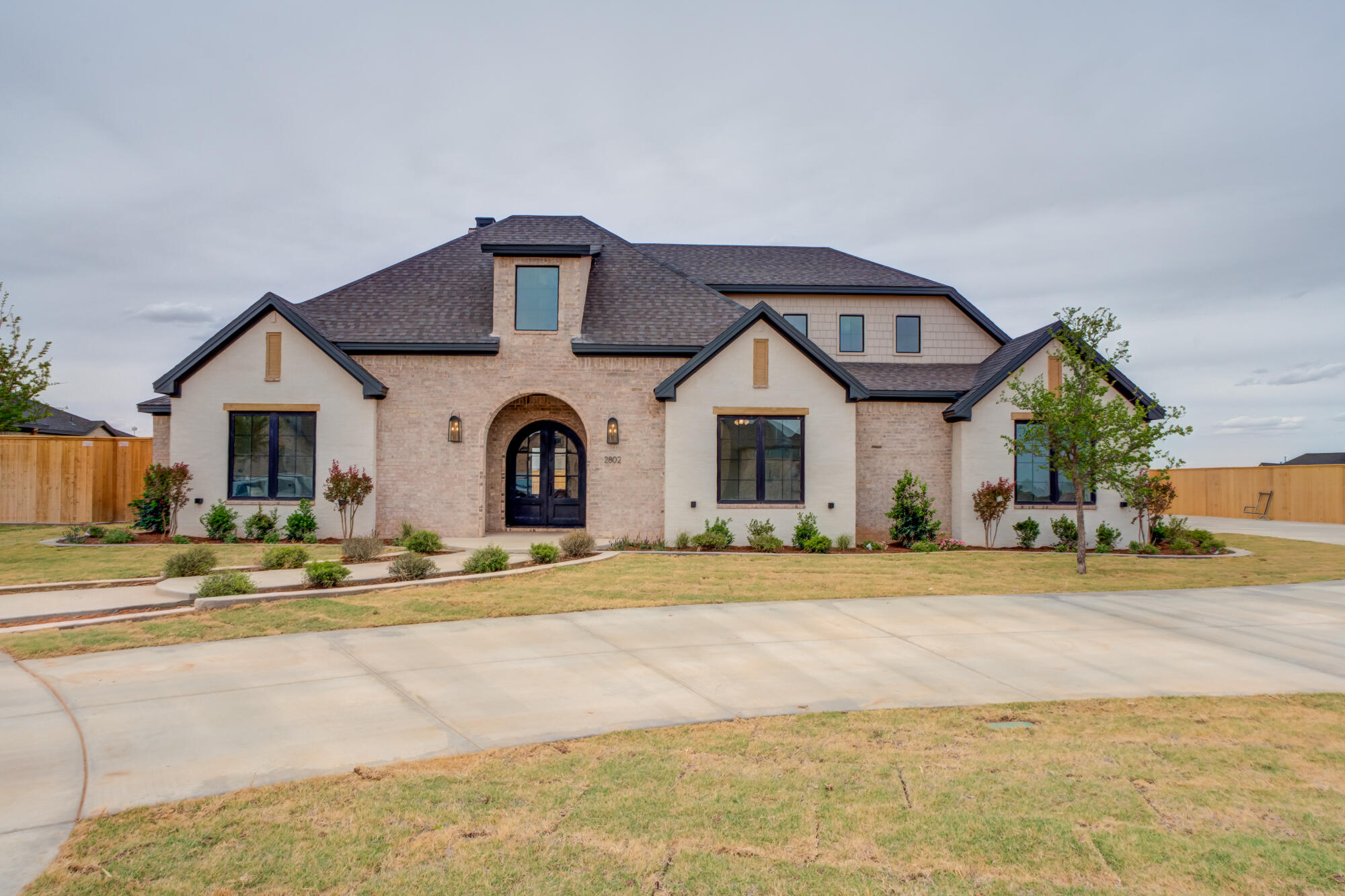 2802 151st Street Lubbock, TX 79423 - Photo 1 of 60 a front view of a house with a garden