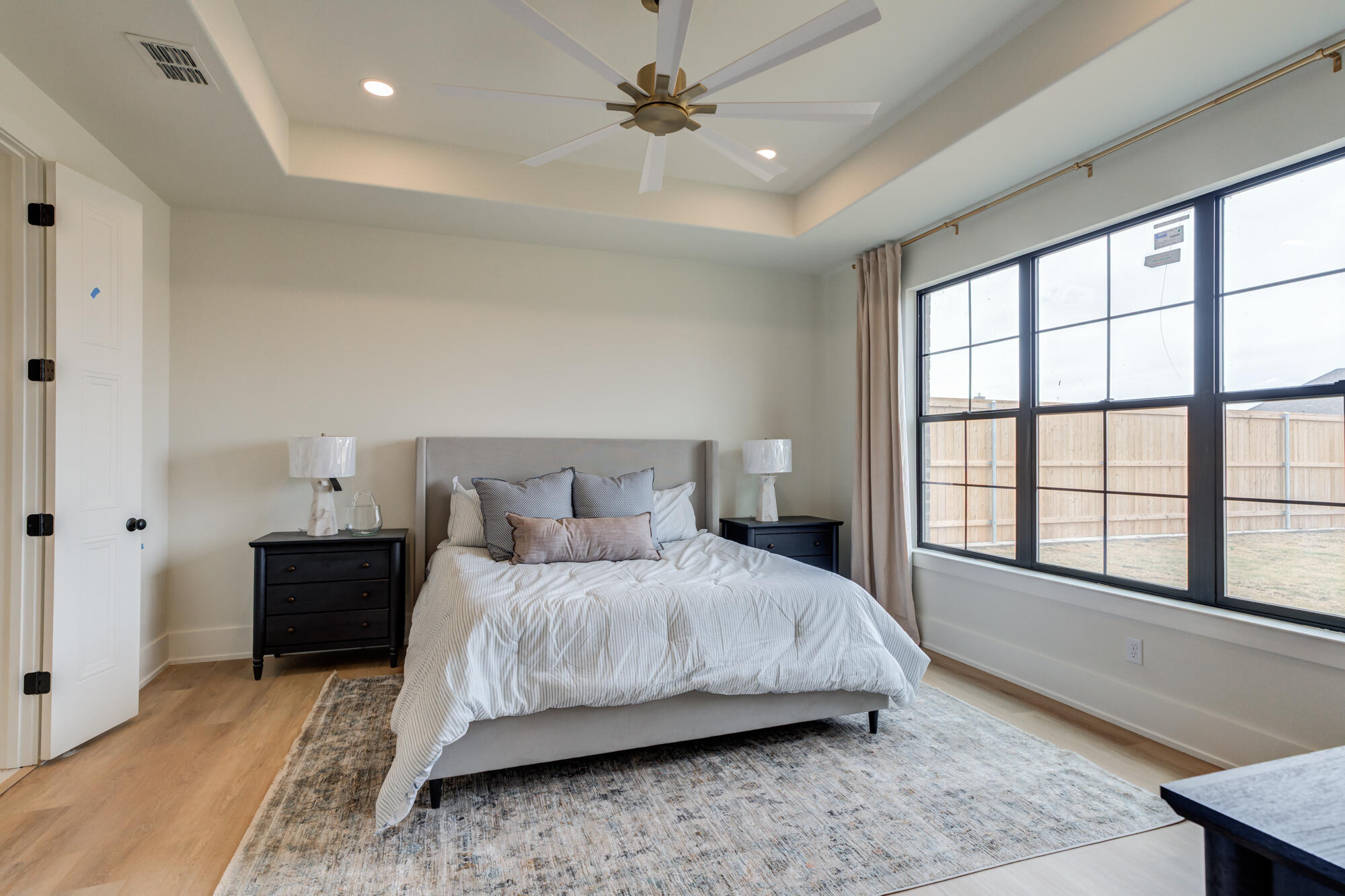 2802 151st Street Lubbock, TX 79423 - Photo 29 of 60 a bedroom with a bed and a large window
