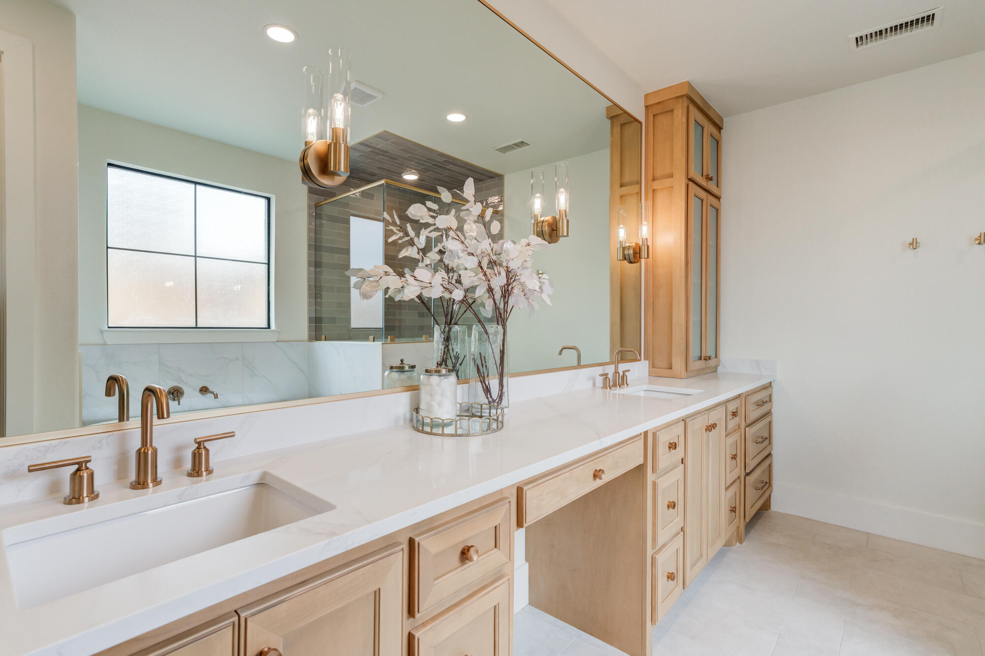 2802 151st Street Lubbock, TX 79423 - Photo 32 of 60 a bathroom with a double vanity sink and a mirror