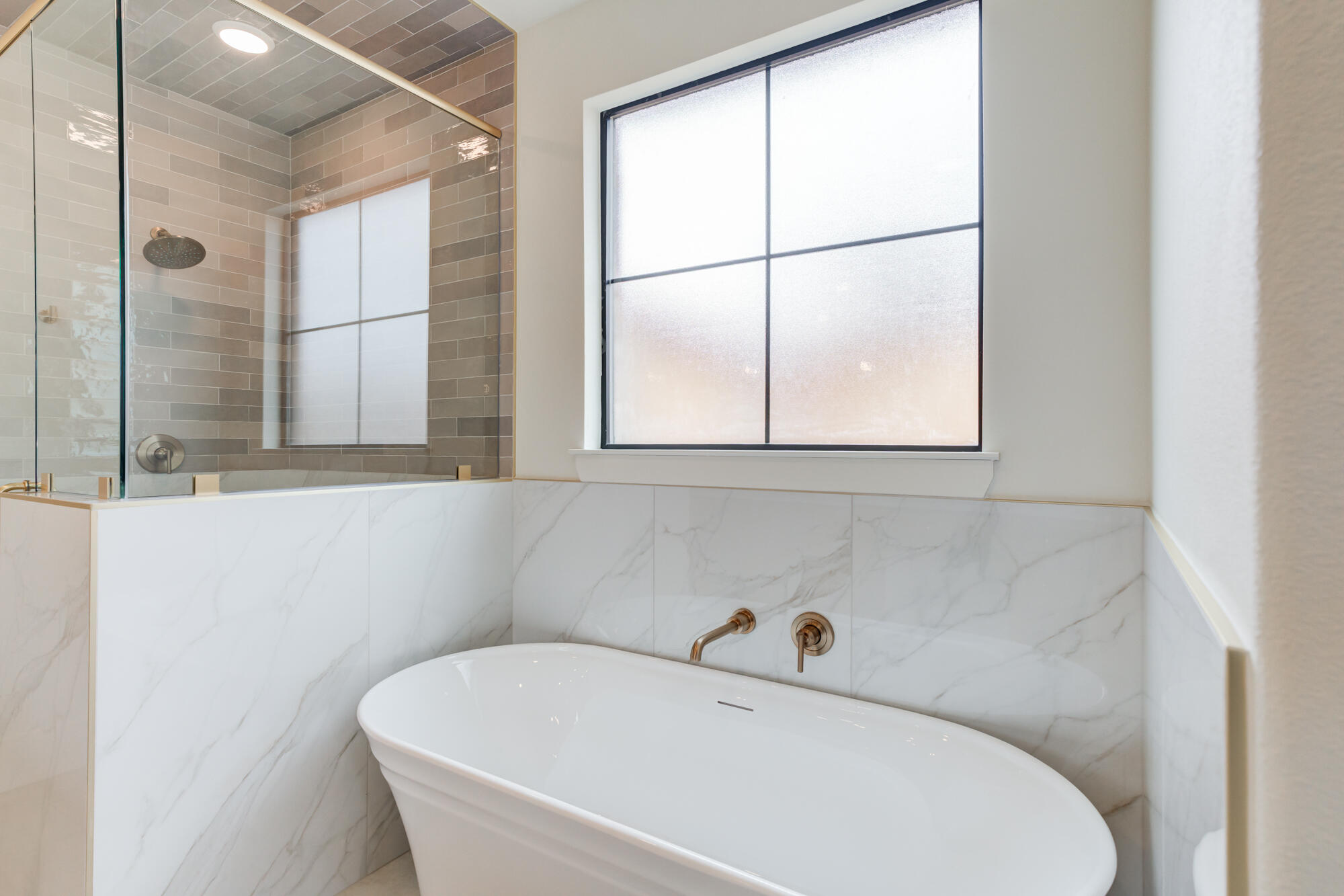 2802 151st Street Lubbock, TX 79423 - Photo 33 of 60 a bathroom with a bathtub and a window