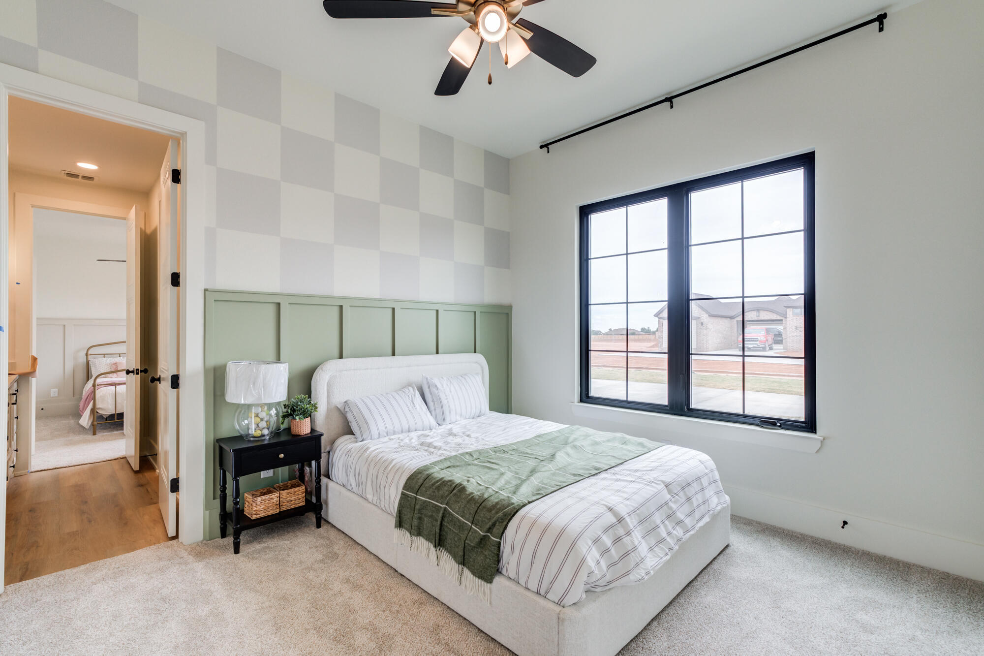 2802 151st Street Lubbock, TX 79423 - Photo 42 of 60 a bedroom with a bed and a chandelier