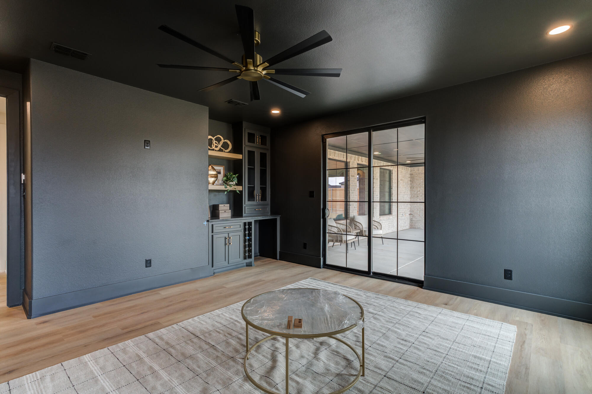 2802 151st Street Lubbock, TX 79423 - Photo 49 of 60 a view of an empty room with a window and wooden floor