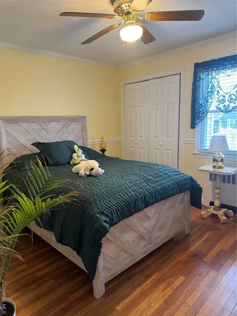 a bedroom with a bed and window