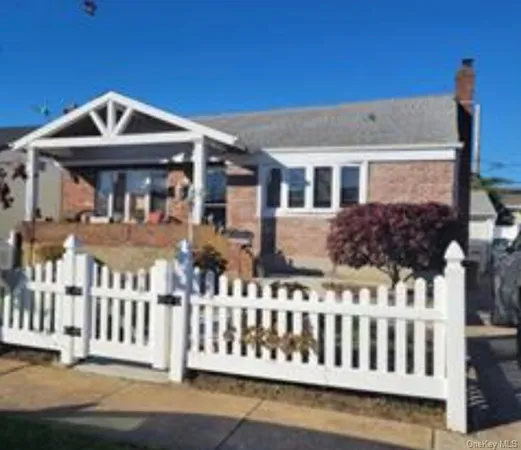 a front view of a house with a small yard